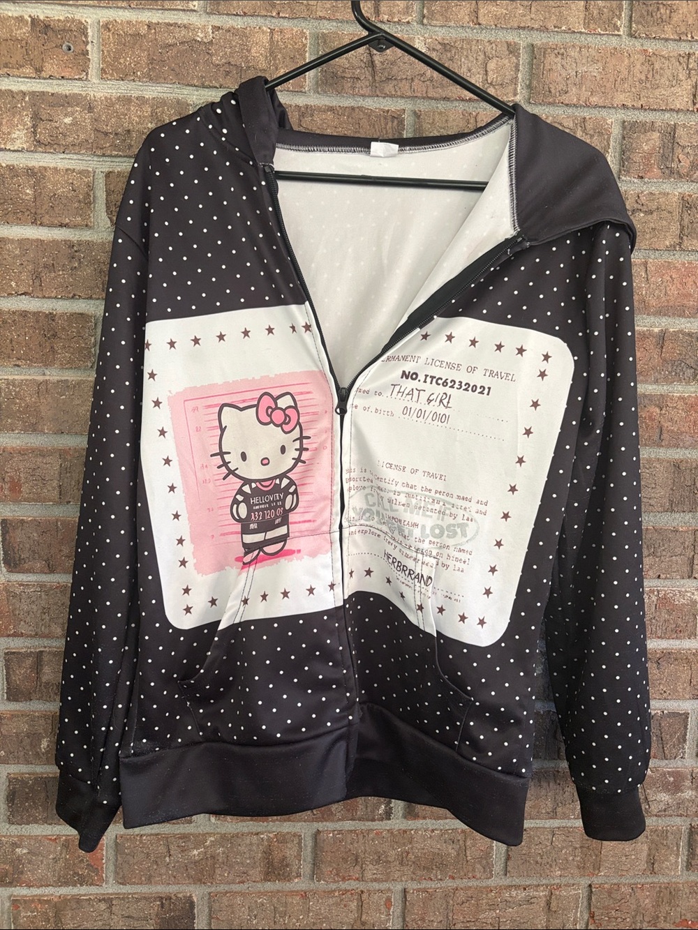 Hello Kitty Black and White Polka Dot Zip-Up Hoodie with Pink Graphic